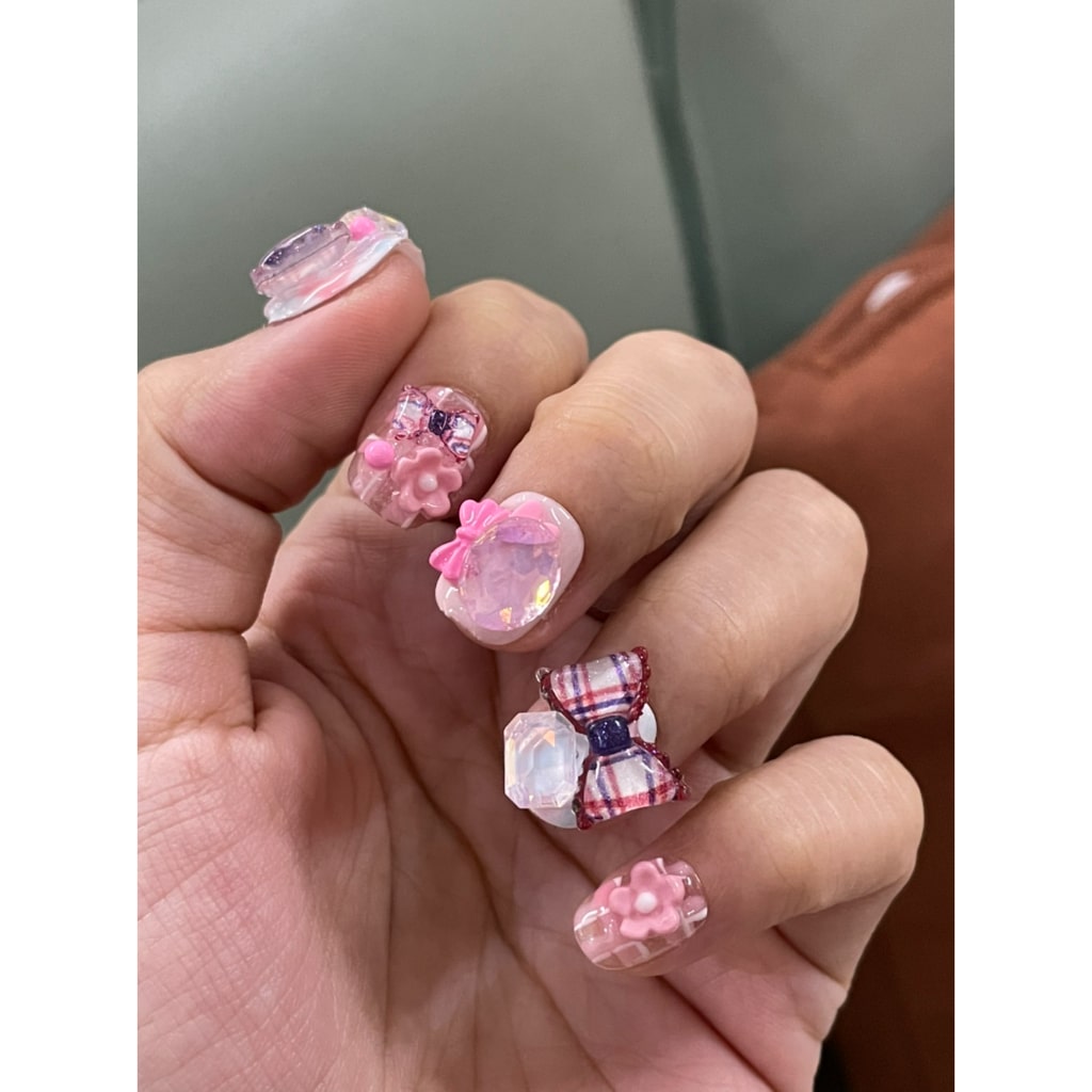 Pink nails with Rhinestone & Pattern Bow & Flower & Heart Charms
